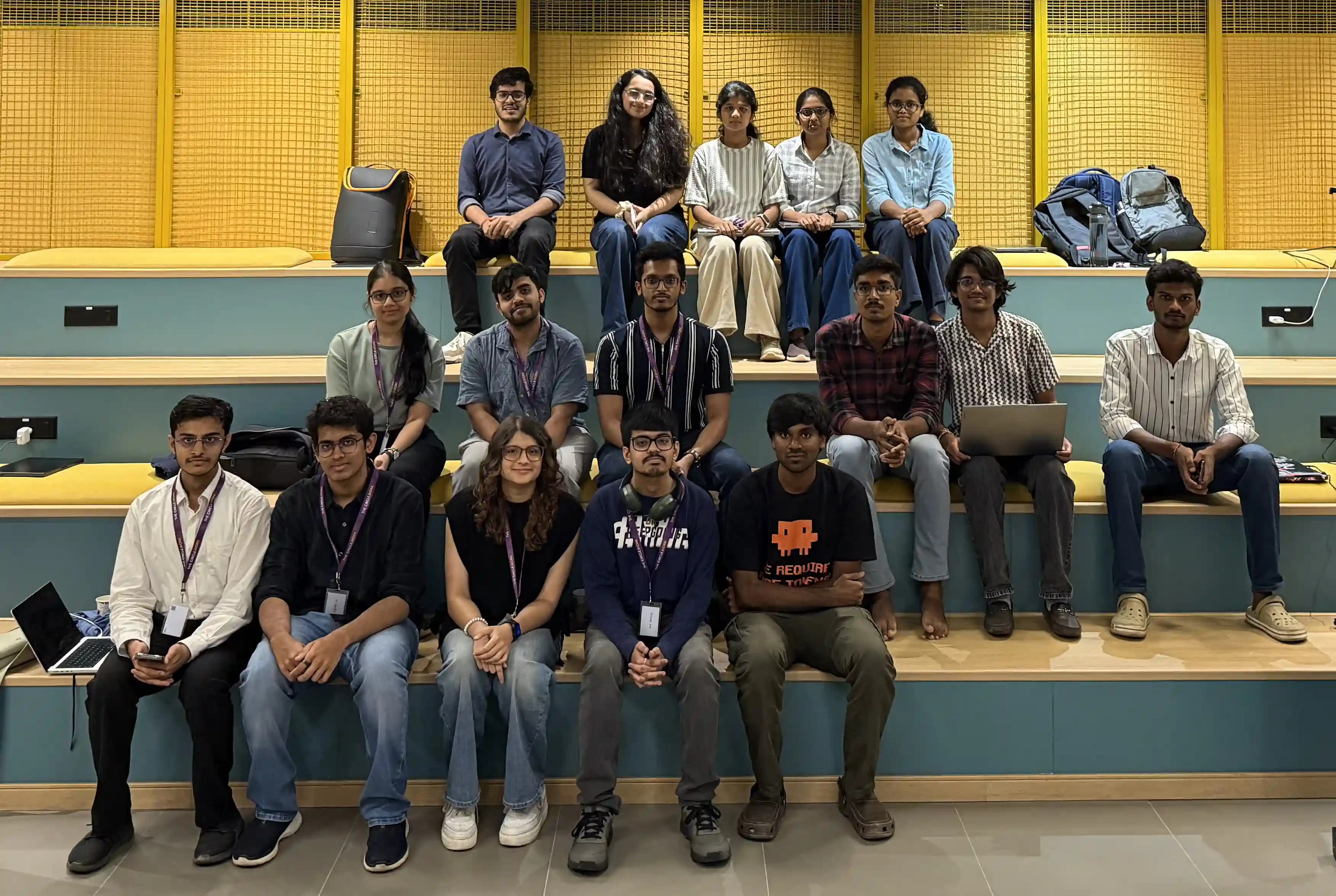 Participants of the Bengaluru jam site seated on tiered steps for a group photo